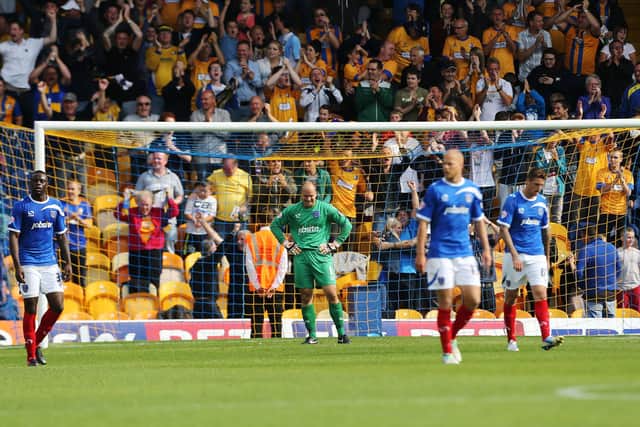 Phil Smith is dejected after Mansfield equalise in his penultimate Pompey match in August 2013. Picture: Joe Pepler