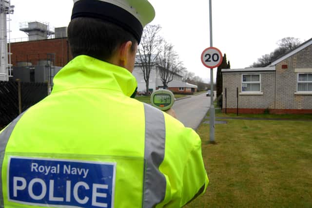 Pictured: A Leading Regulator in the navy carries out duties at HMS Sultan