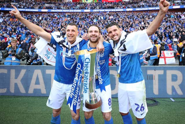 Lee Brown, Brett Pitman and Gareth Evans celebrate Pompey's Checkatrade Trophy triumph in March 2019. Picture: Joe Pepler