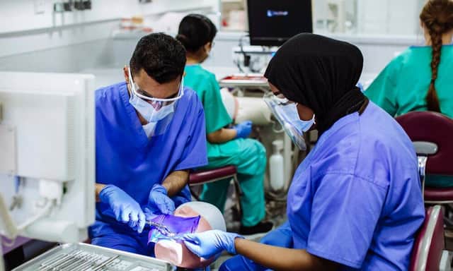 University of Portsmouth Dental Academy students working and training


