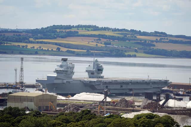 Aircraft carrier HMS Prince of Wales as it leaves  Rosyth docks after repairs. 
Photo: Andrew Milligan/PA Wire