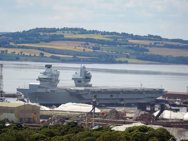 Aircraft carrier HMS Prince of Wales as it leaves  Rosyth docks after repairs. 
Photo: Andrew Milligan/PA Wire