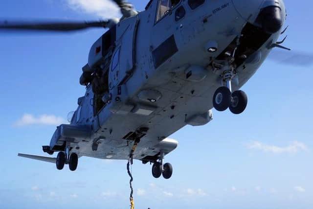 HMS Medway pictured in the Caribbean as a Merlin helicopter lands on the ship for the first time. Photo: Royal Navy