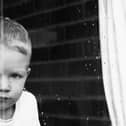 Hollie Long encapsulates lockdown with her image, Finn in Window.