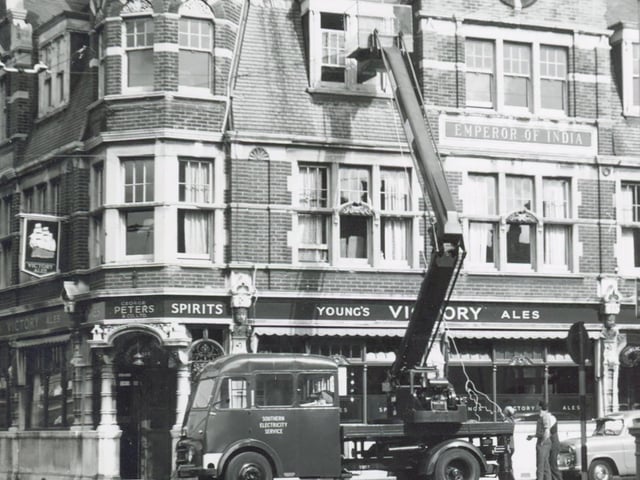 Christmas decorations being put up n Commercial Road, Portsmouth in 1956.Picture: Wright & Logan Photographers