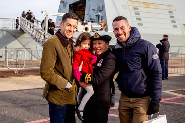 Lieutenant Kelly Jenkins-Hill reunites with husband Daniel Hill, left, daughter Sophia, three, and brother Simon Jenkins, right, at HMS Defender's homecoming,
Photo: Habibur Rahman