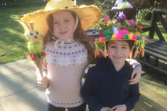 Portsmouth Grammar School pupils, Lily and Ivan, in their Easter bonnets.
