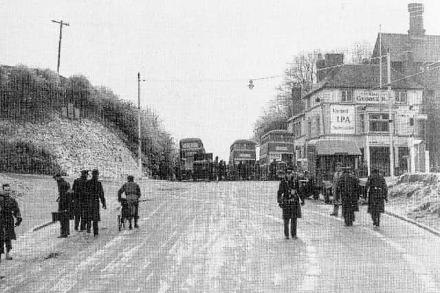Iced up outside The George. In January 1940 it was so cold that buses could not get down Portsdown Hill because of the ice on London Road. Picture: Tony Triggs collection.