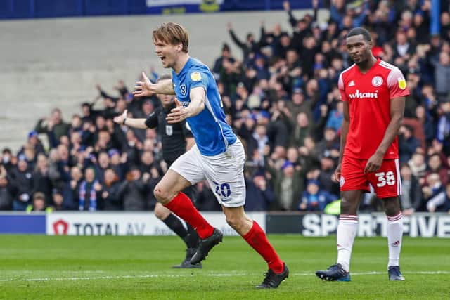 Sean Raggett celebrates his goal today.