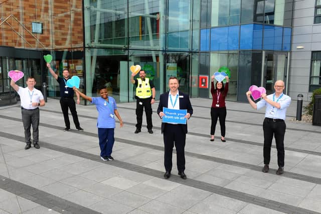 Mark Cubbon, chief executive of Portsmouth Hospitals Trust with staff while thanking people for supporting the hospital during the pandemic
Picture: Sarah Standing (030420-7700)