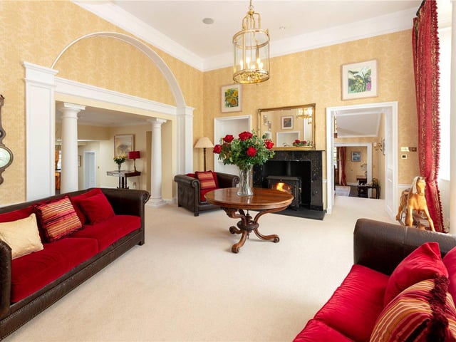 The principal reception rooms are fitted with high ceilings, stunning fireplaces and cornicing, as well as beautiful chandeliers