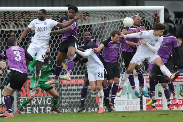 Craig Robson, right, tries to get a head on the ball as St Albans defend. Picture: Dave Haines.