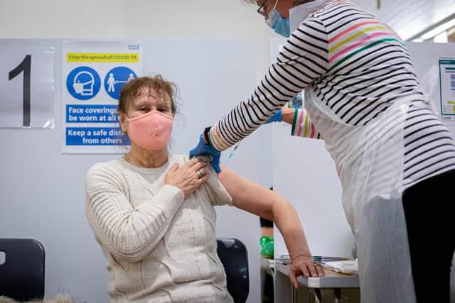 People being vaccinated at Emsworth Baptist Church, Emsworth on 19 January 2021. Pictured:  Dorothy Palmer getting her vaccine by Dr Caroline Kenedy-Cooke. Picture: Habibur Rahman