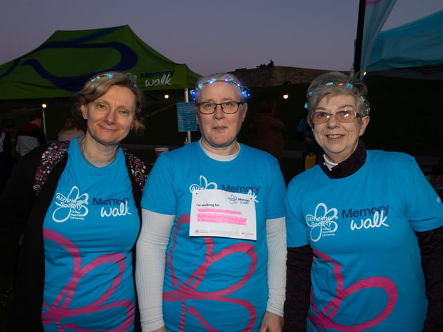 Helen Restall, Toni Vogel and Fiona Sweet came to Castle Field, Southsea to take part in the Alzheimers Society Glow Walk on Friday evening. Photos by Alex Shute