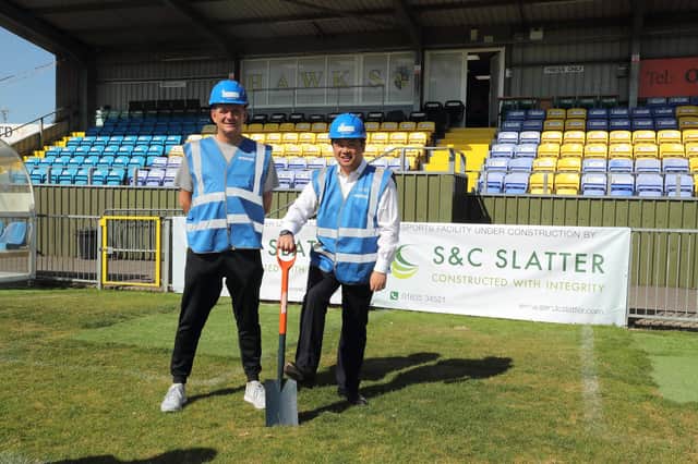 Hawks manager Paul Doswell and MP Alan Mak prepare to start digging up the Westleigh Park pitch this morning. Photo by Dave Haines.