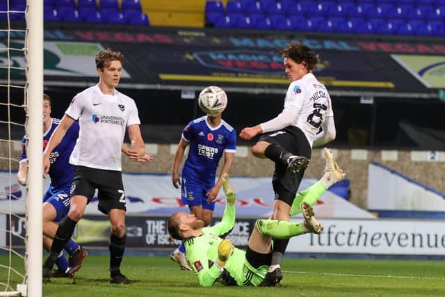 Rasmus Nicolaisen heads at goal before Sean Raggett applies the final touch to his Ipswich winner