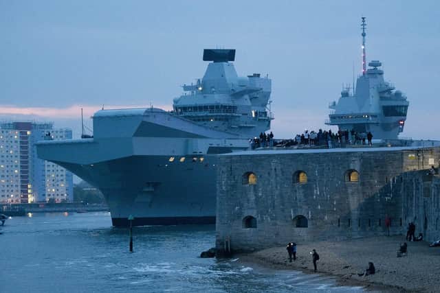 Pictured: Royal Navy flagship HMS Queen Elizabeth left Portsmouth. 

HMS Queen Elizabeth is the largest and most powerful vessel ever constructed for the Royal Navy. It is capable of carrying up to 40 aircraft.

© Will Dax/Solent News & Photo Agency