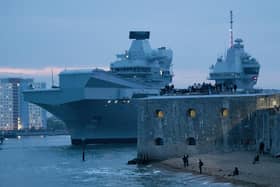 Pictured: Royal Navy flagship HMS Queen Elizabeth left Portsmouth. 

HMS Queen Elizabeth is the largest and most powerful vessel ever constructed for the Royal Navy. It is capable of carrying up to 40 aircraft.

© Will Dax/Solent News & Photo Agency