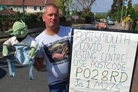 Adrian Ramsden, from Tipner Lane, with his sign directing people to the coronavirus testing facility. Picture: Supplied