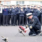 The commanding officer, HMS Sultan, Captain John Voyce OBE lays a wreath