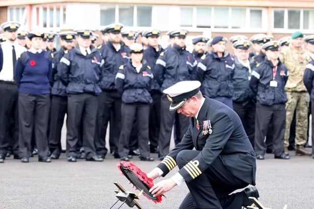 The commanding officer, HMS Sultan, Captain John Voyce OBE lays a wreath