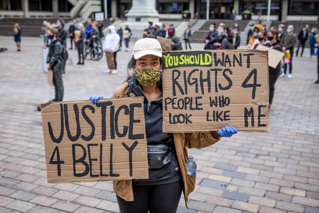 Shakira Newton displays a strong message at the protest.
Picture: Habibur Rahman