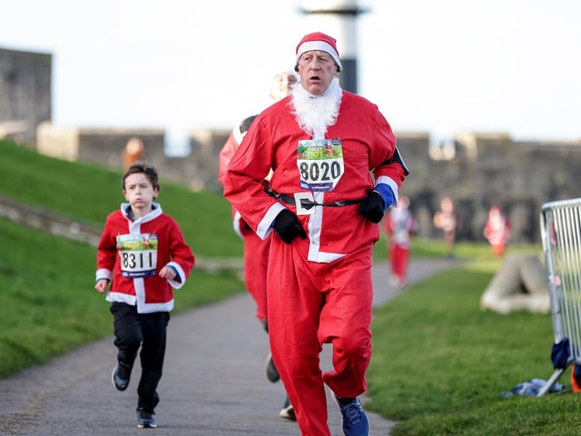 A number of runners took to the picturesque coastal route to take on the Portsmouth Coastal Waterside Marathon, Festive Half Marathon as well as the Southsea 5k and 10k Turkey Trot. Picture: Chris  Moorhouse (221224-79)