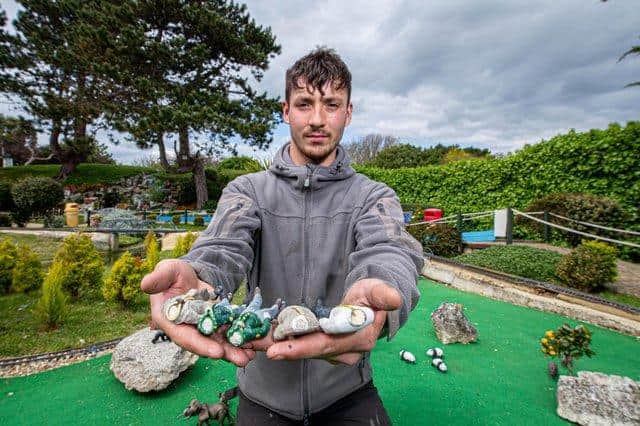 Assistant manager, Harry Wilson with some of the damaged miniature figures at Southsea Model Village following last Sunday's break-in. Picture: Habibur Rahman