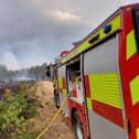 Crews are still battling the blaze in Hartley Wintney.