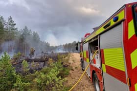 Crews are still battling the blaze in Hartley Wintney.