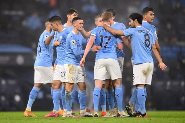 No socially distanced celebrations - Manchester City players after Phil Foden's goal against Brighton on Wednesday. Pic: LAURENCE GRIFFITHS/POOL/AFP via Getty Images.