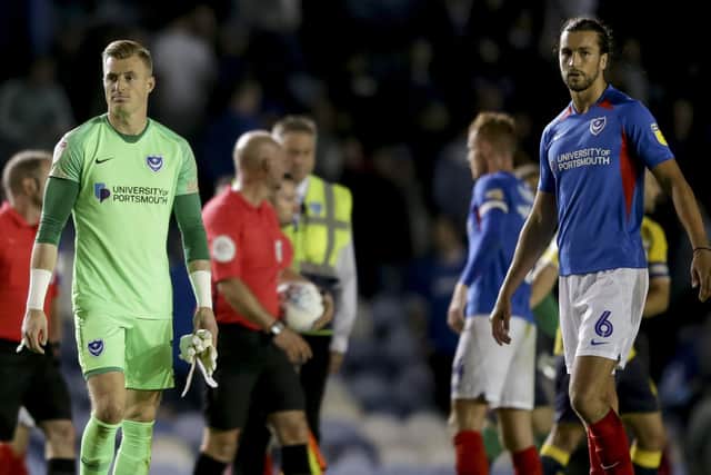 Craig MacGillivray and Christian Burgess dejected after Pompey's 3-3 draw with Coventry. Picture: Robin Jones.