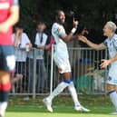 Mo Faal and Danny Wright celebrate after the former had netted Hawks' third goal at Hampton & Richmond. Picture by Dave Haines