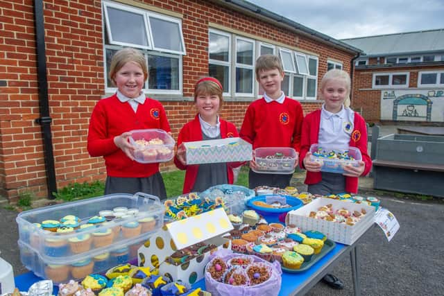 Pictured: Grace 8, Penny 8, Zachary 8 and Madison 9 ready with their cakes to sell. 
Picture: Habibur Rahman
