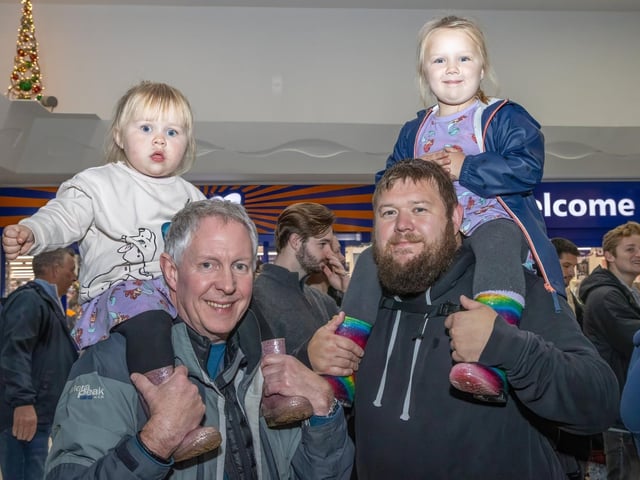 The crowds braved the wind and rain to watch the Christmas lights being switched on in Fareham highstreet on Saturday evening, while some of the entertainment was moved into the shopping centre.Pictured - Ava, 2 with Grandad and Nora, 5 with DadPhotos by Alex Shute