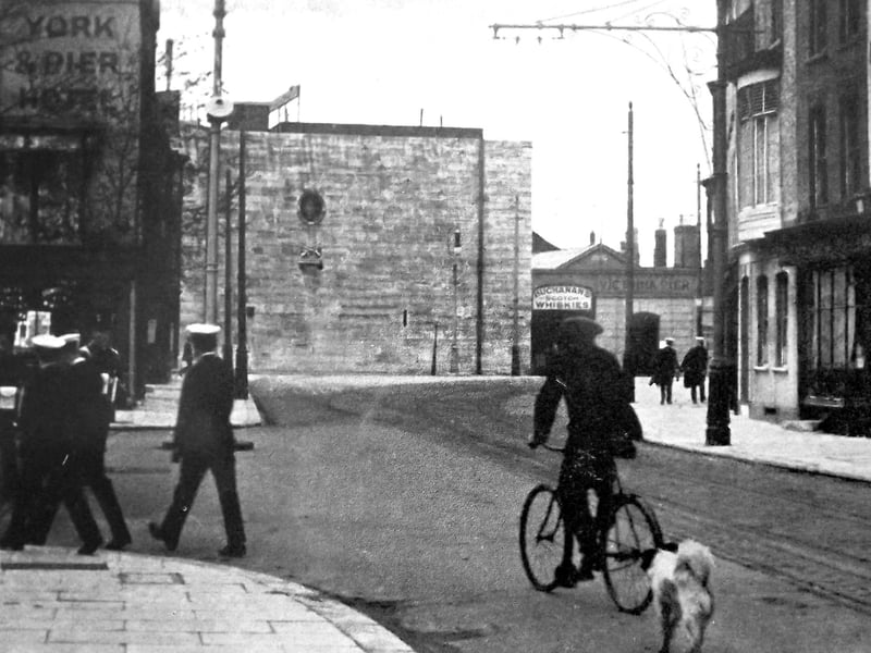 Square tower sailors.
The Square Tower from the High Street Old Portsmouth. There are plenty of military or navy personnel in this image. Everyone in this photograph is wearing a uniform of some kind.