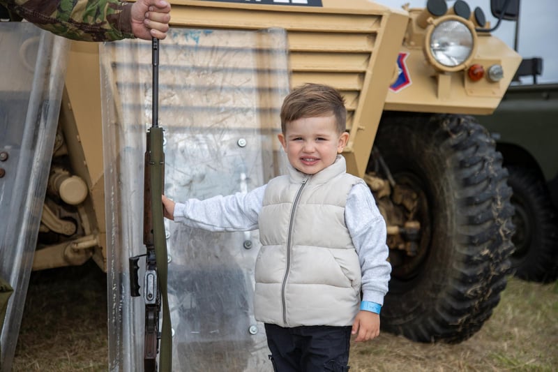 Pictured - Ralph Carter, 3, enjoying handling a rifle