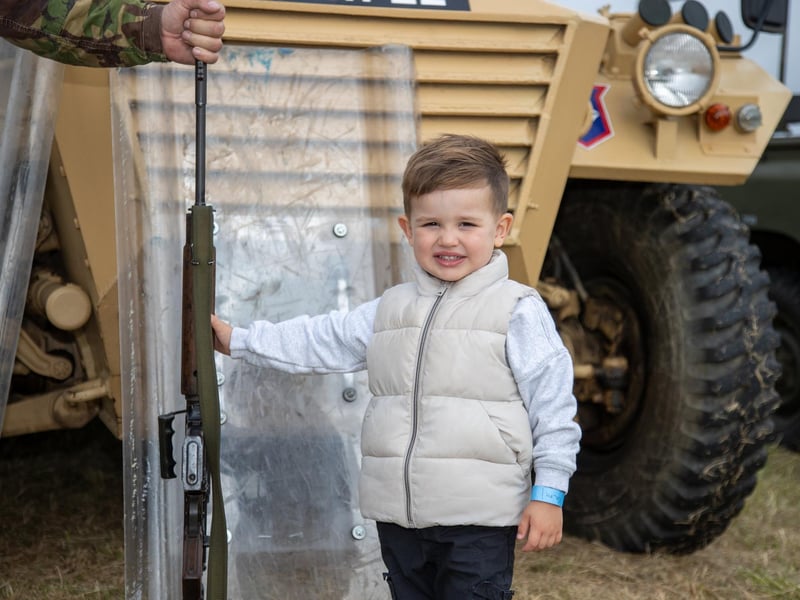Pictured - Ralph Carter, 3, enjoying handling a rifle