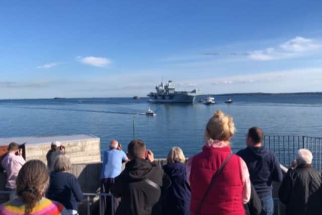 HMS Queen Elizabeth returned to Portsmouth this afternoon with a large crowd in Old Portsmouth welcoming her home .
