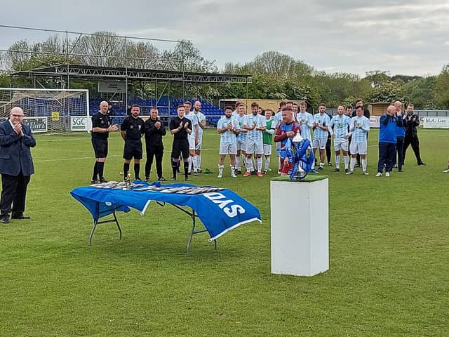 Hamworthy United's Steve Devlin about to collect his man of the match award following the Hammers' 3-1 win over US Portsmouth in the Wessex League Cup final at AFC Portchester this afternoon.