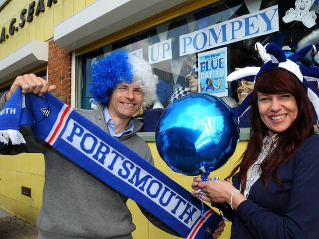 Steve Searle and Sarah Wellham hold a Portsmouth scarf outside U-Need-Us in May 2010 ahead of the FA Cup final which Pompey played in. Picture: Ian Hargreaves (101530-1)