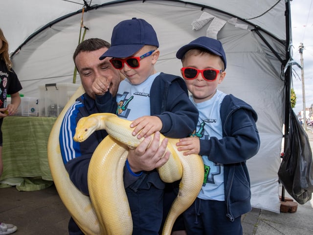 Henry, 4, with brother Riley, 4, and Dad on Duncan Road.  Photos by Alex Shute