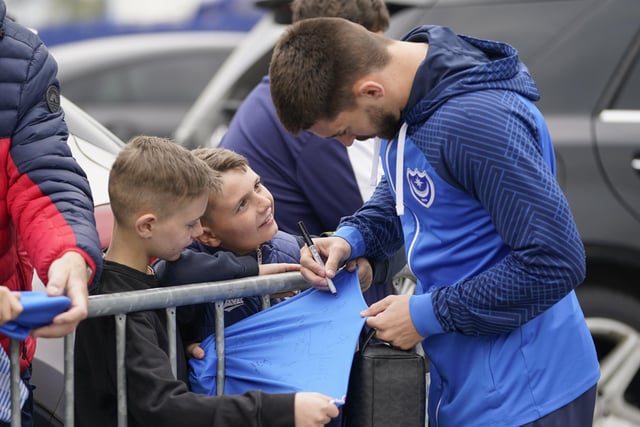 Owen Dale makes these young fans' day by signing their Pompey shirts.
