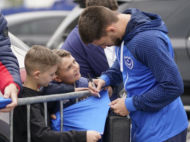 Owen Dale makes these young fans' day by signing their Pompey shirts.