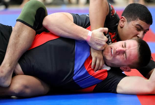 Sean Overton and Mahmoud El Maghawry, top, competing in a Brazilian Jiu Jitsu competition at the Ravelin Centre in Portsmouth. Picture: Chris Moorhouse (jpns 250223-11)