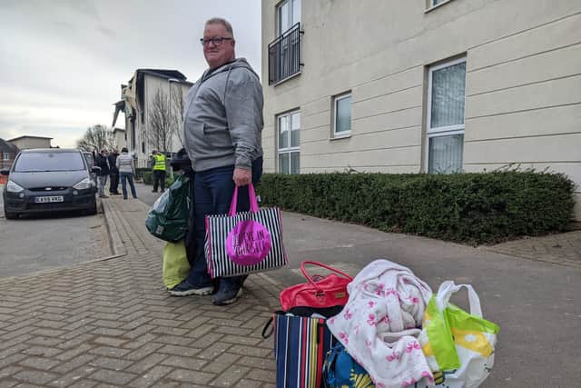 Resident Ian Mould after grabbing bags of essentials from his flat. Picture: Emily Turner