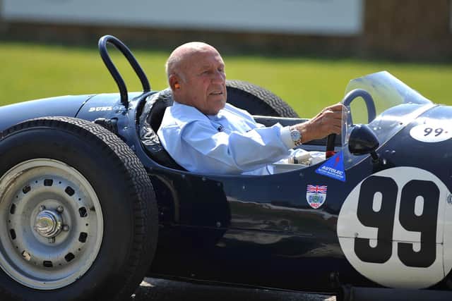 Sir Stirling Moss driving an historic Grand Prix car after taking part in the Goodwood Festival of Speed in 2011.