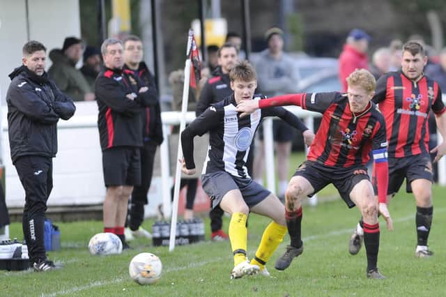 Tommy Woodward, right (red/black) is one of the experienced players Rich Bessey has brought to Fleetlands to help get the club into the Wessex League. Picture: Ian Hargreaves