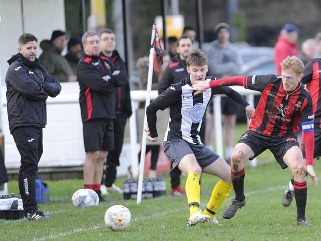 Tommy Woodward, right (red/black) is one of the experienced players Rich Bessey has brought to Fleetlands to help get the club into the Wessex League. Picture: Ian Hargreaves