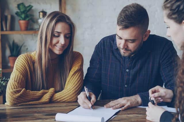 Couple signing a Will